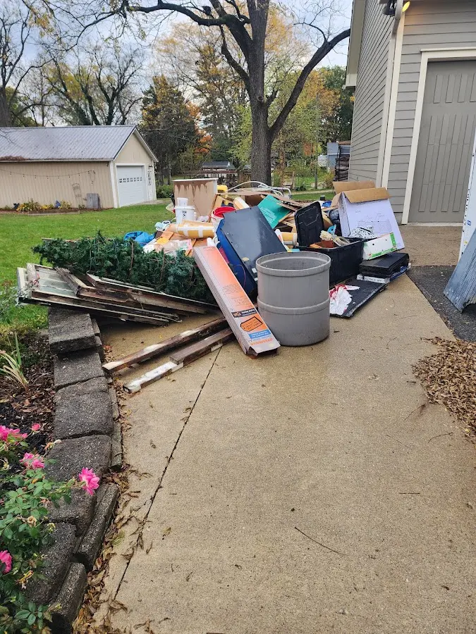 Dumpster being loaded with debris for 3 Yard Dumpster Rental in Wade Hampton